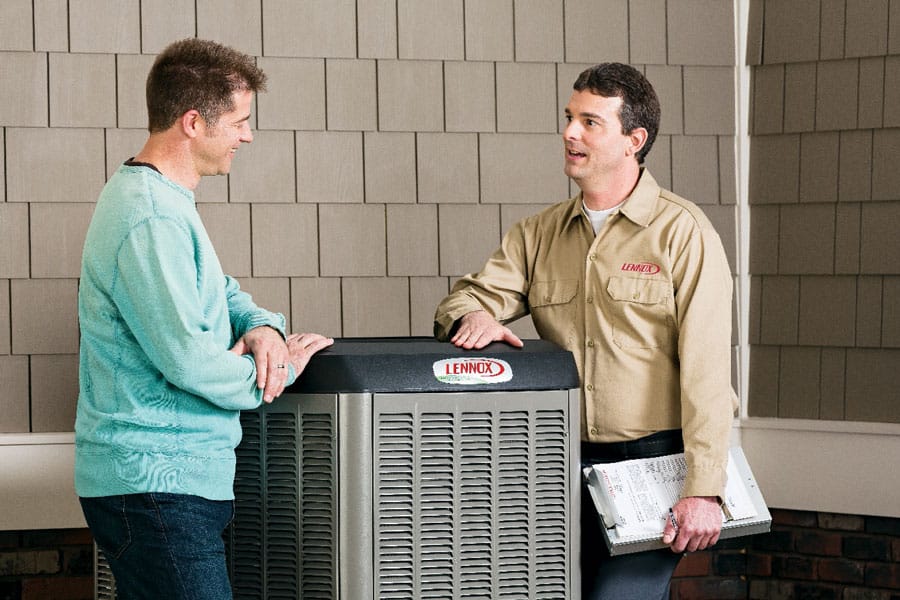 Robinson Heating & Cooling Outdoor Dealer with Customer